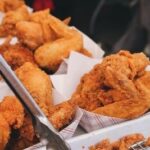 A close-up shot of Hooters' classic wings, showcasing their signature sauces and crispy texture