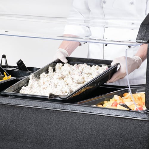 Potato salad on a buffet table, exemplifying TCS food handling