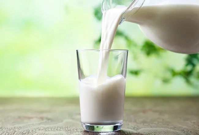 Glass of milk with sunlight