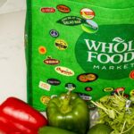 Whole Foods grocery bag filled with healthy foods and potentially alcohol