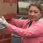 Woman carrying boxes of food