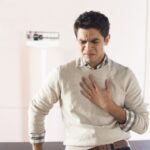 Young man heartburn